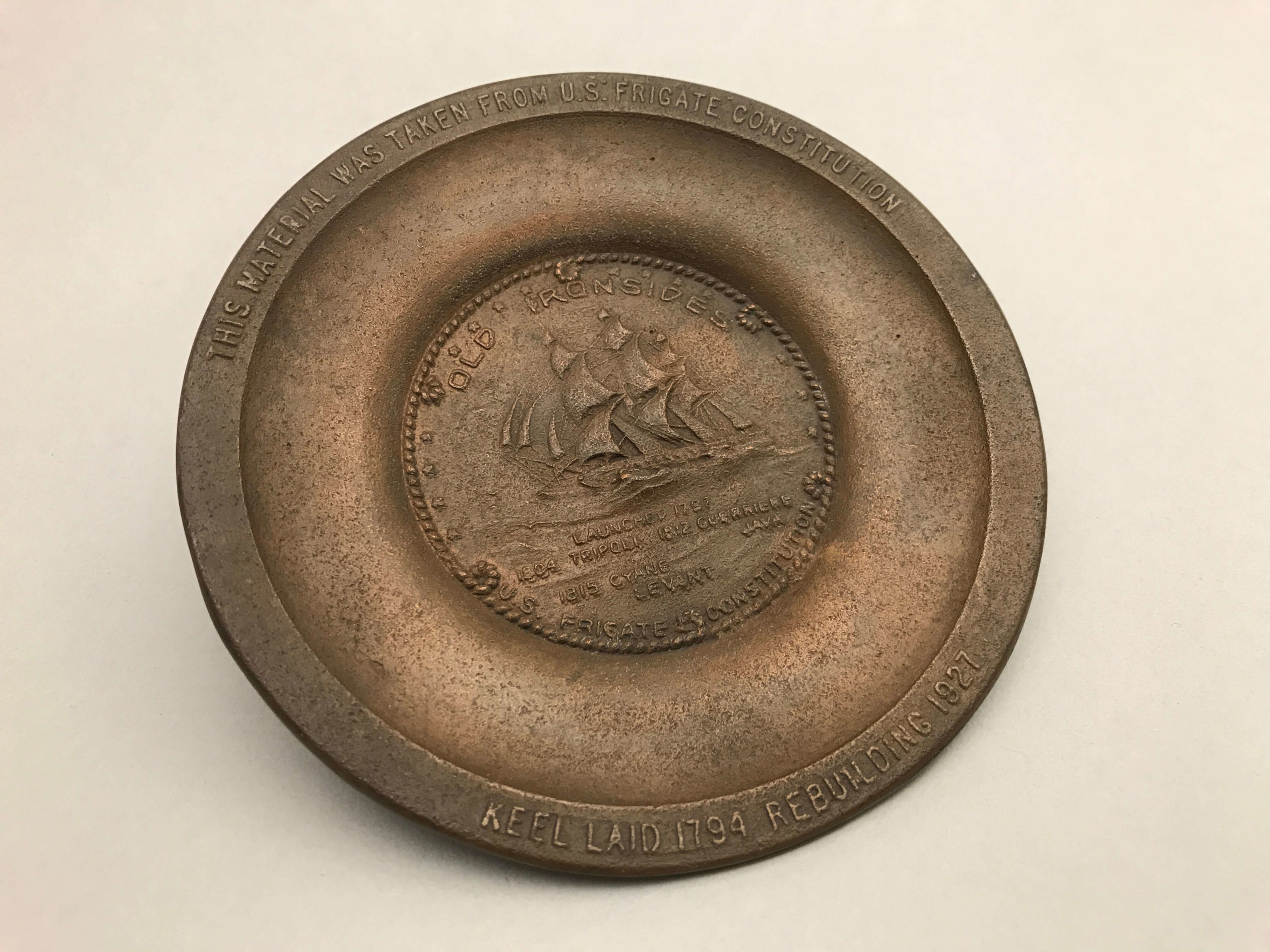 Souvenir pin tray made of material removed from USS Constitution during the 1927-1931 restoration. [Commodores Fund Purchase]